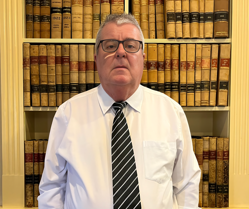 Man in white shirt, striped tie